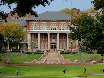 Students cross the Court of North Carolina on their way to and from class.